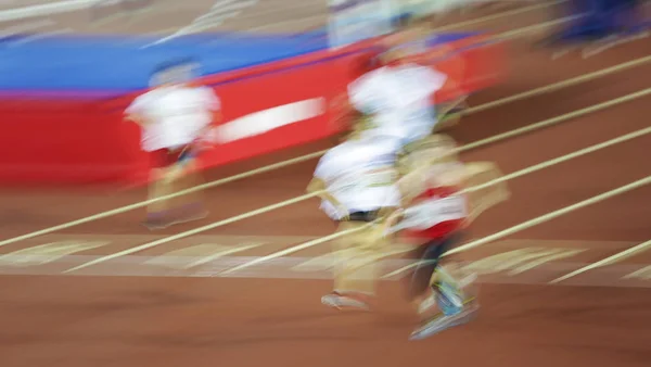 Atletas Que Correm Movimento Desfoque Estádio Esportivo — Fotografia de Stock