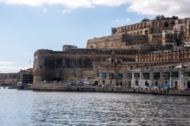 Valleta Malta- 8 February 2020:  Ancient Harbour of Valetta with Upper Barakka Gardens in background