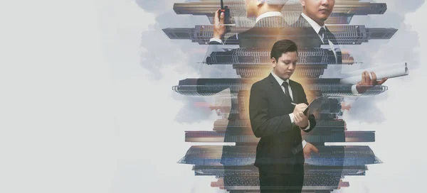 Double exposure of a businessman working and cityscape on whit b