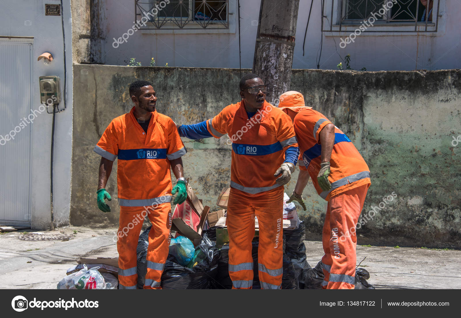 The urban workers from COMLURB, municipal cleaning company, working in