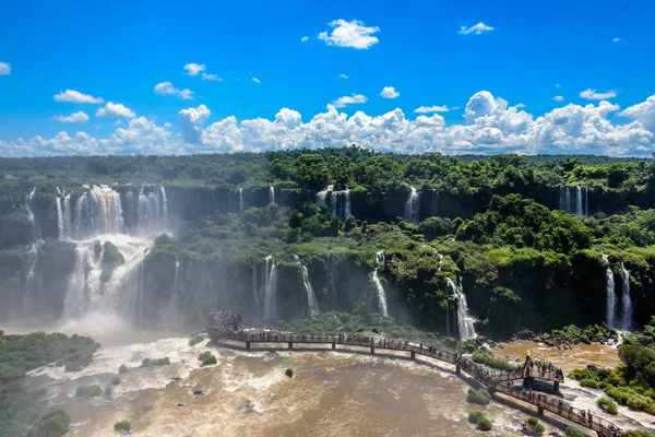 Aerial view of waterfalls cascade of Iguazu Falls with extensive tropical forest and vertical clouds in Iguacu National Park — Stock Photo, Image