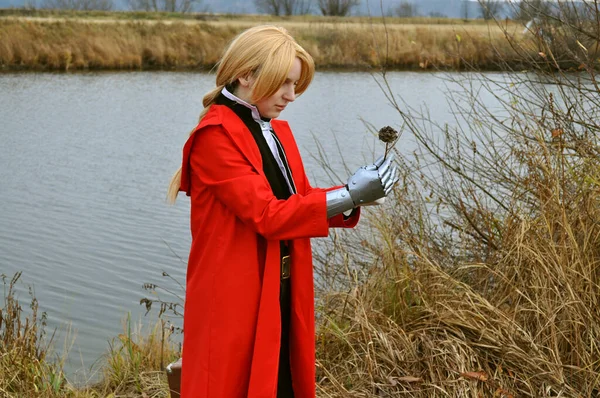 A girl dressed as Edward Elric from the anime Fullmetal Alchemist