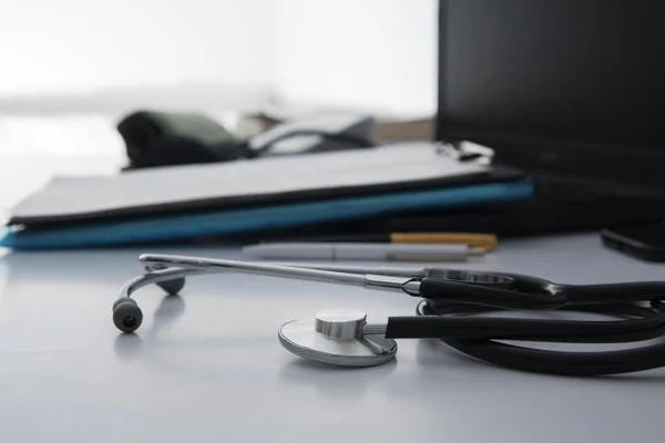 Close-up stethoscope on a white table of a doctor. Workplace of — 스톡 사진