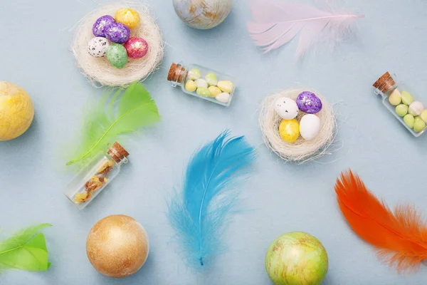 Top View Easter Eggs Nest Glass Bottles Colorful Feathers Blue — Stock Photo, Image