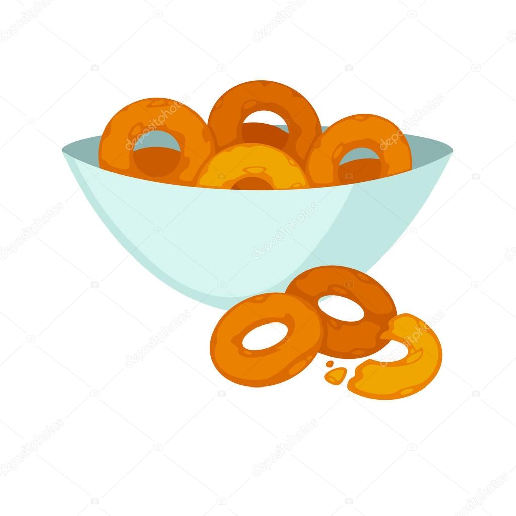 Round crispy bagels in deep plate
