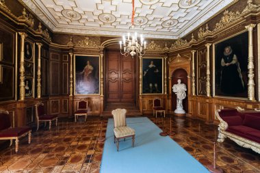 Schwerin, Germany - Sept 10, 2017: interior and exhibition of the Schwerin Castle Museum. The museum shows the splendor of ducal times with beautiful rooms, weapons, fine china and silver. clipart