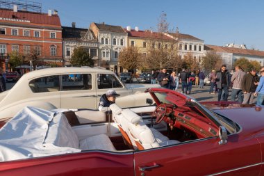 Cluj Napoca, Romania - 26 Oct, 2019: Visitors at the Retro Mobile Autumn Parade in Cluj Napoca, Romania, Oldtimer Show in Cluj Napoca. 