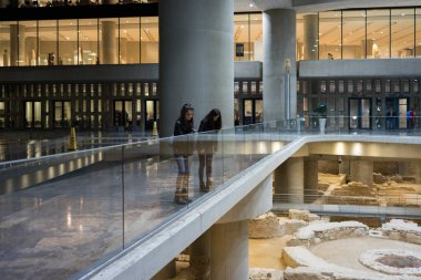 Athens, Greece - Dec 20, 2019: Visitors at the Ancient Athens revealed below the new Acropolis Museum, Athens, Greece, 
