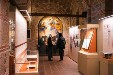 Meteora, Greece - Dec 16, 2019: Visitors inside the Museum of the Varlaam Monastery in Meteora, Greece. 