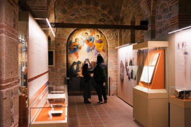 Meteora, Greece - Dec 16, 2019: Visitors inside the Museum of the Varlaam Monastery in Meteora, Greece. 