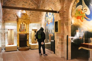 Meteora, Greece - Dec 16, 2019: Visitors inside the Museum of the Varlaam Monastery in Meteora, Greece. 