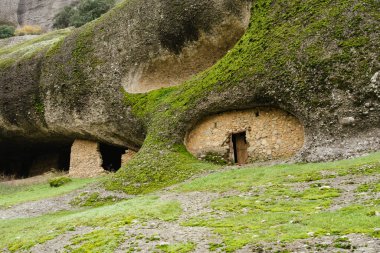 Meteora, Greece - Dec 19, 2019: Abandoned monastic cave houses known as 