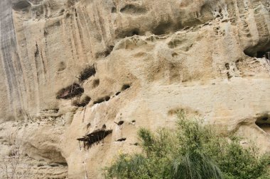 Meteora, Greece - Dec 19, 2019: Abandoned monastic cave houses known as 