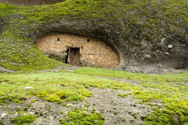 Meteora, Greece - Dec 19, 2019: Abandoned monastic cave houses known as 