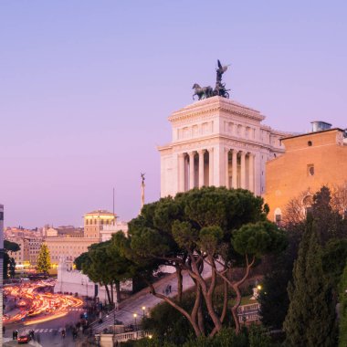 Rome, Italy - Jan 1, 2020: Altar of the Fatherland or Monumento Nazionale a Vittorio Emanuele II (National Monument to Victor Emmanuel II) in Rome, Italy, with night traffic