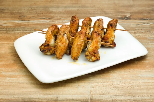 Plate of delicious barbecue chicken wings — Stock Photo, Image