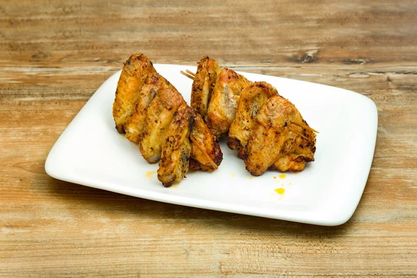 Plate of delicious barbecue chicken wings — Stock Photo, Image