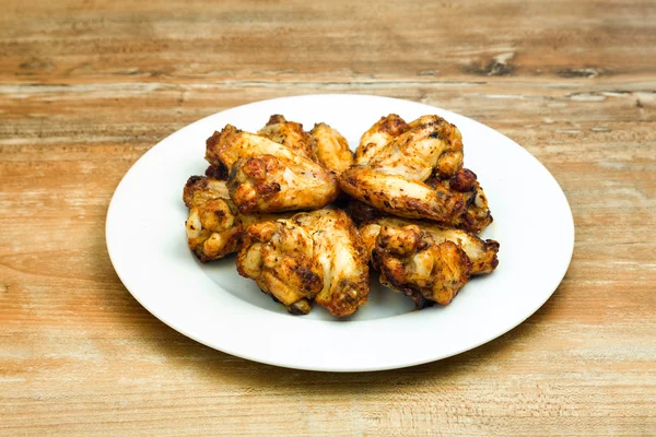 Plate of delicious barbecue chicken wings — Stock Photo, Image