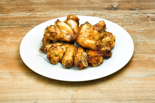 Plate of delicious barbecue chicken wings — Stock Photo, Image