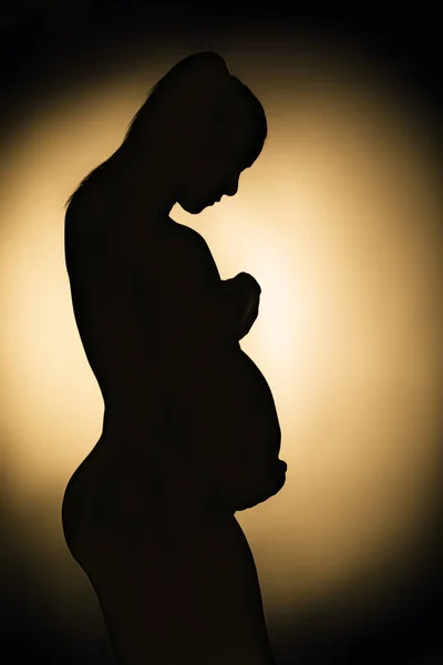 Silhouette of pregnant woman monochrome — Stock Photo, Image