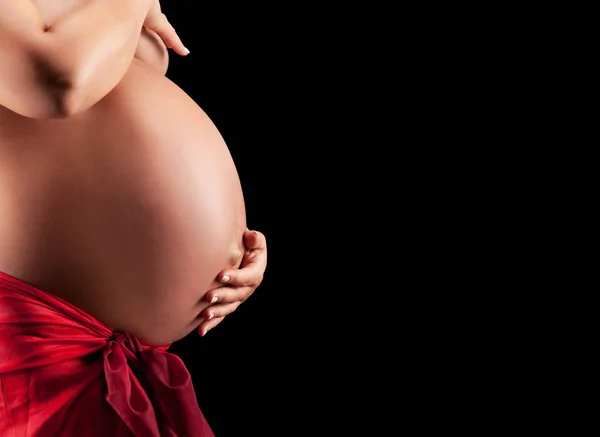 Schitterende naakte zwangere vrouw strelen haar buik — Stockfoto