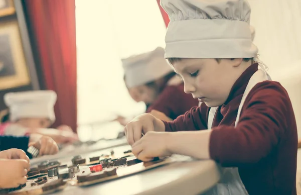 Boys Cheefs Hats Making Sweets Table — Stock Photo, Image