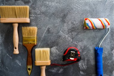 handle working tools at abstract textured cement surface