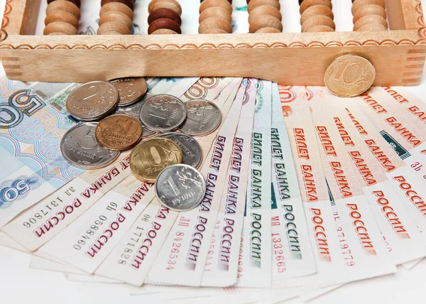 Russian money with a wooden abacus — Stock Photo, Image