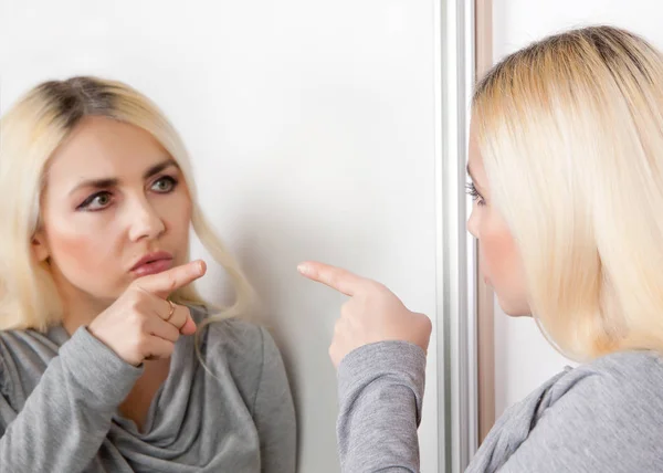 Woman Points Her Finger Her Reflection Mirror Stock Photo