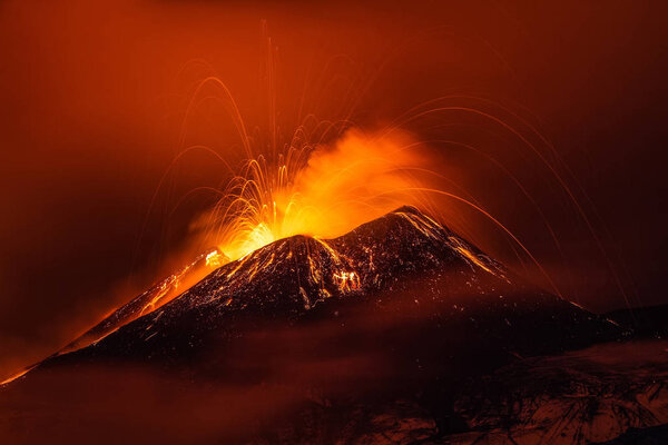 Volcano eruption landscape at night - Mount Etna in Sicily