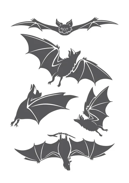 Siluetas de murciélagos negros — Vector de stock