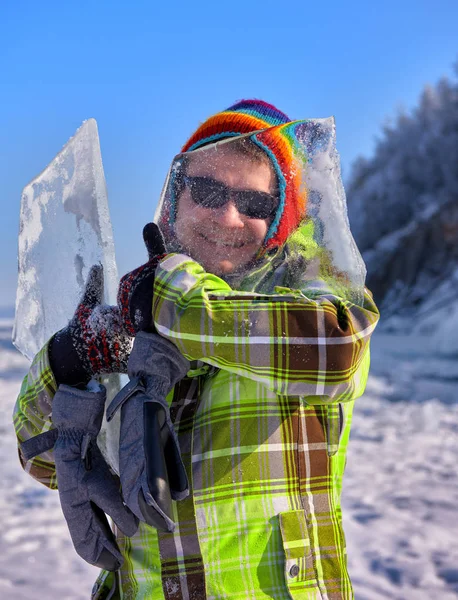 Merry fellow looks through thin ice — Stock Photo, Image