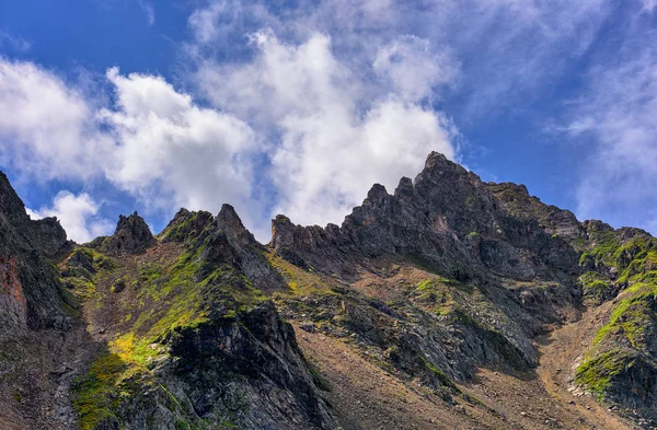 Mountain peaks exposed to weathering erosion — Stock Photo, Image