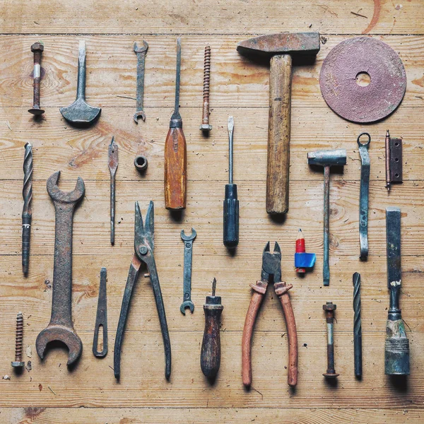 Old dirty vintage repair tools on wooden background — Stock Photo, Image