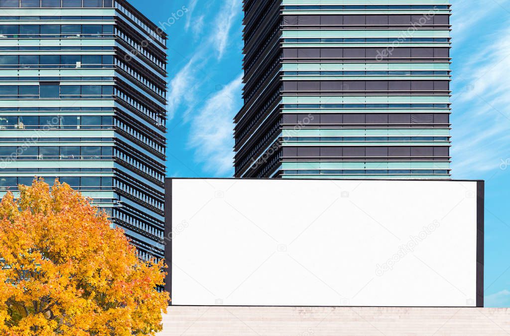 Blank outdoor billboard mockup with modern business buildings
