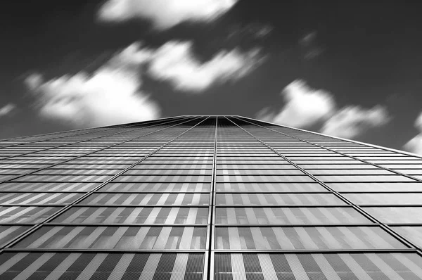 Modern architecture abstract with clouds in motion blur