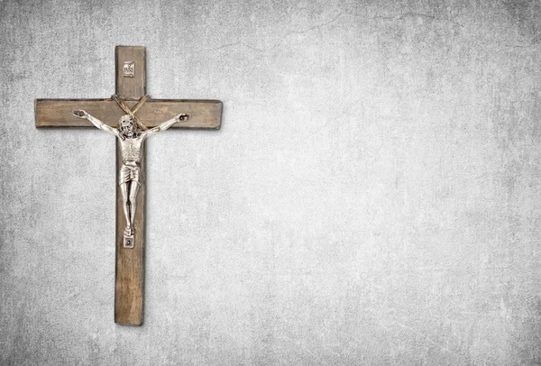 Christian background with crucifix of Jesus Christ on gray concrete wall — Stock Photo, Image