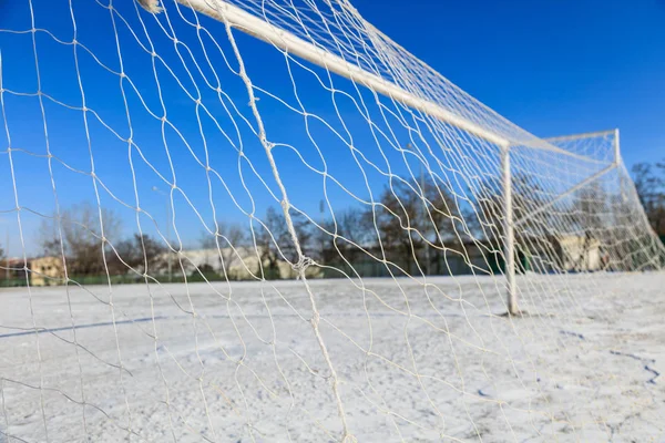 Empty snowy soccerball field — Stock Photo, Image