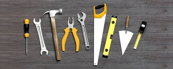 Hand tools on grey wooden background. 3d illustration — Stock Photo, Image