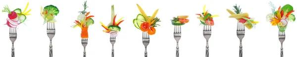 Variety of fresh vegetables on forks - white background — Stock Photo, Image