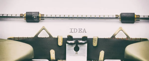 IDEA palabra en mayúsculas en una hoja blanca — Foto de Stock