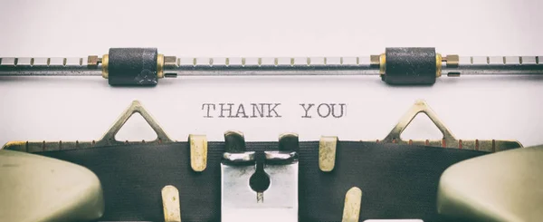 Slovo Děkuji hůlkovým písmem na listu psací stroj — Stock fotografie