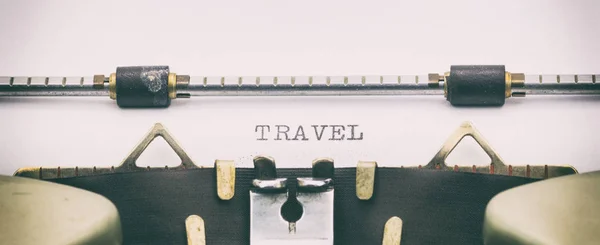 TRAVEL word in capital letters on white sheet — Stock Photo, Image