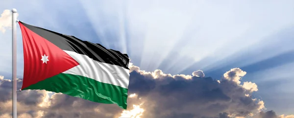 约旦国旗在蔚蓝的天空。3d 图 — 图库照片