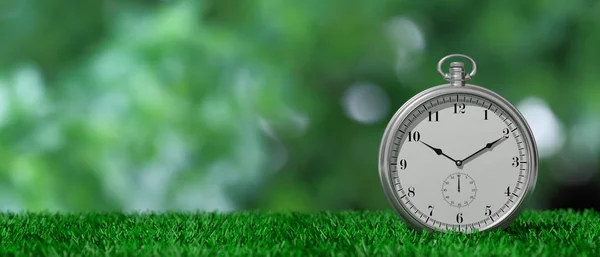 Pocket watch isolated on green grass and green abstract background, copy space. 3d illustration — Stock Photo, Image