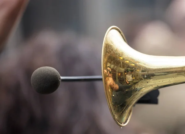 Brass trumpet, front side with microphone for loud sound. Close up view with details, blurred background. — Stock Photo, Image