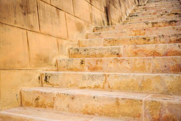 Stone wall and stairs in Valletta, Malta. Empty staircase for background. Close up view.
