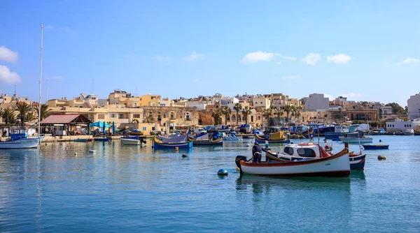 Marsaxlokk historic port full of boats in Malta. Blue sky and village background. — Stock Photo, Image