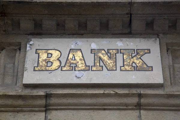 Firma de banco en fachada de piedra —  Fotos de Stock