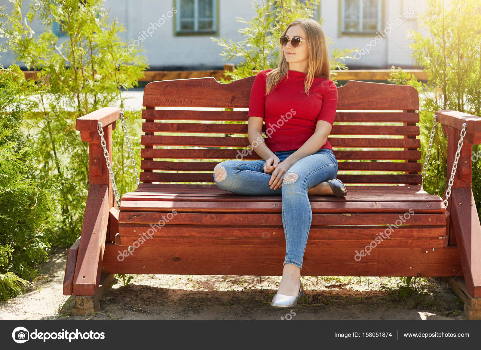 Outdoor Portrait Of Carefree Stylish Teenage Female Wearing Red